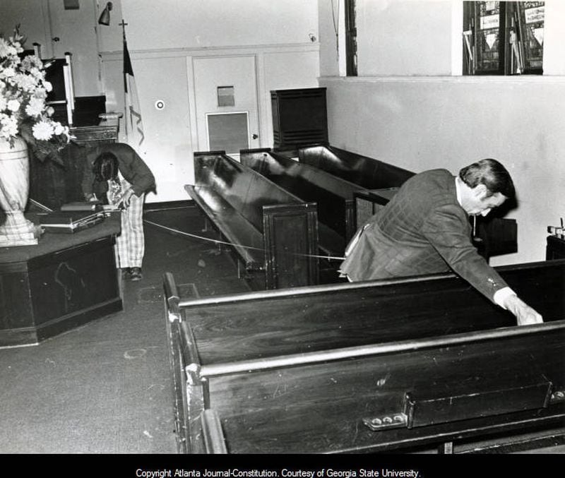 1974 -- Investigators search the crime scene at Ebenezer Baptist Church in Atlanta after the assassination of Alberta Williams King, mother of slain civil rights leader Dr. Martin Luther King, Jr. BILL MAHAN / AJC FILE