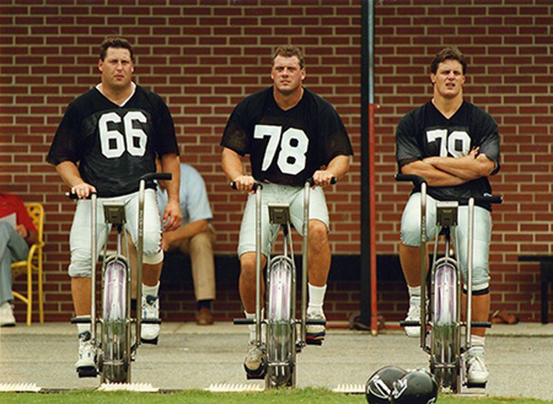 Ben Utt (from left), Mike Kenn, and Bill Fralic train on bicycles during practice. In addition to Utt and Kenn, Fralic played on lines with Jeff Van Note, Jamie Dukes, Chris Hinton and John Scully. (AJC)