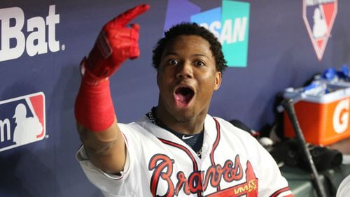 Atlanta Braves left fielder Ronald Acuna celebrates after hitting a grand slam home run in the dugout in the second inning against the Los Angeles Dodgers in Game 3 of a National League Division Series baseball game Sunday, October 7, 2018, in Atlanta. Curtis Compton/ccompton@ajc.com