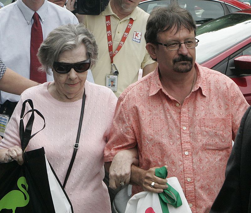 Powerball winner Gloria C. Mackenzie, 84 (left), leaves the lottery office escorted by her son, Scott Mackenzie, after claiming a single lump-sum payment of about $370.9 million before taxes in June, in Tallahassee, Fla. She is the largest sole lottery winner in U.S. history.