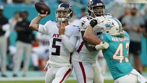 Atlanta Falcons quarterback AJ McCarron (5) looks to pass during the first half of a NFL football game against the Miami Dolphins, Sunday, Dec. 13, 2020, in Miami Gardens, Fla. (AP Photo/Lynne Sladky)