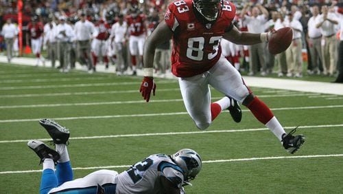 Falcons tight end Alge Crumpler scores against the Panthers in their 2007 game at the Georgia Dome. CURTIS COMPTON / Staff