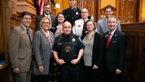 Suwanee Police Chief Mike Jones (center) was honored in the Georgia Senate for winning the Georgia Chief of the Year award.