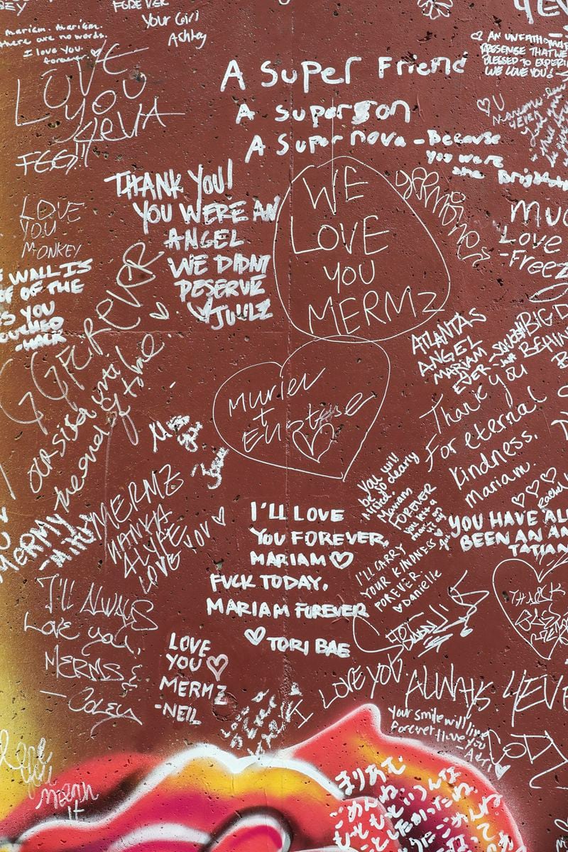 Personal messages to Mariam Abdulrab adorn the memorial mural to her on Wylie Street. As state legislators and others explore ways to combat a recent increase in violent crime, the case of Demarcus Brinkley, the suspect in Abdulrab's murder, highlights the persistent challenge of curbing violence by repeat offenders. (John Spink / john.spink@ajc.com)

