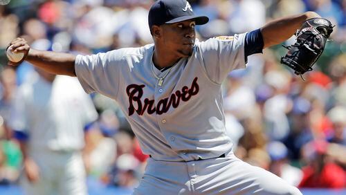 Atlanta Braves starter Julio Teheran throws against the Chicago Cubs during the first inning of a baseball game in Chicago, Sunday, July 13, 2014. (AP Photo/Nam Y. Huh)