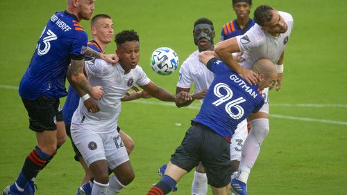 Inter Miami CF defender Leandro Gonzalez Pirez (26) heads the ball in front FC Cincinnati defender Andrew Gutman (96) during the first half of an MLS soccer match at Inter Miami CF Stadium on Sunday, November 8, 2020, in Fort Lauderdale, Florida. (David Santiago/Miami Herald/TNS)