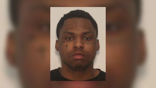 Aaron Woods, 22, of Peachtree Corners, is wanted by Gwinnett County police on a murder charge related to the shooting death of 22-year-old Kendall Reid.