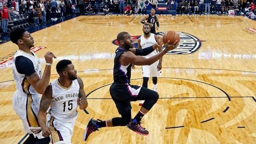 Los Angeles Clippers guard Chris Paul goes to the basket in the first half of an NBA basketball game against the New Orleans Pelicans in New Orleans, Thursday, Dec. 31, 2015. (AP Photo/Gerald Herbert)