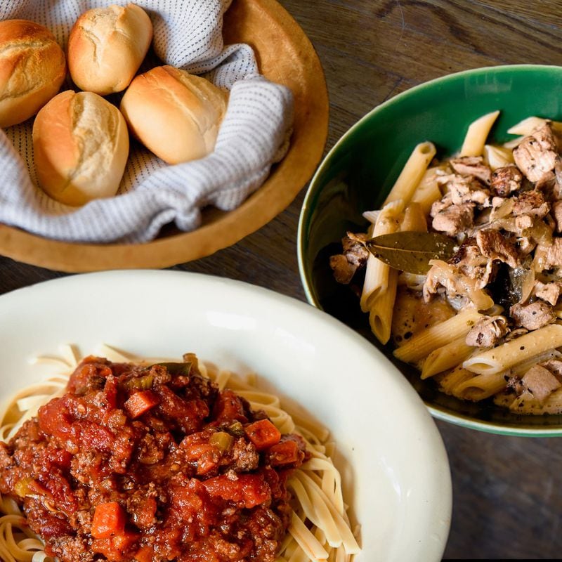 Bell Street Burritos is now offering family-style pasta meals like this Bolognese with fettuccine, and chicken with white wine cream sauce over penne. Rolls and butter are included. CONTRIBUTED BY MATT HINTON / BELL STREET BURRITOS