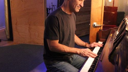 Producer/musician David Barbe plays piano in his Athens studio. Photo: Melissa Ruggieri/AJC