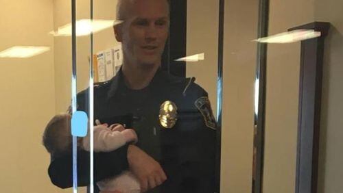 Photographs of a police officer in Utah caring for a baby have gone viral.
