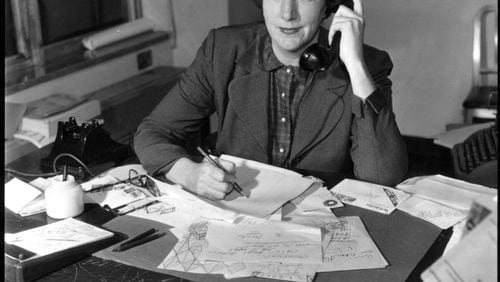 Atlanta Constitution columnist Celestine Sibley at her desk. (1957)