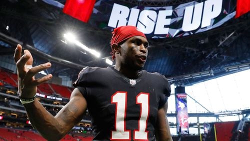 Falcons wide receiver Julio Jones walks off the field after beating the Tampa Bay Buccaneers at Mercedes-Benz Stadium on Nov. 26, 2017, in Atlanta.