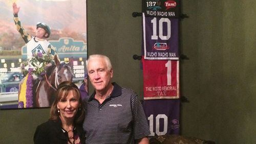 Dean and Patti Reeves at home, with a few reminders of some good days at the races.