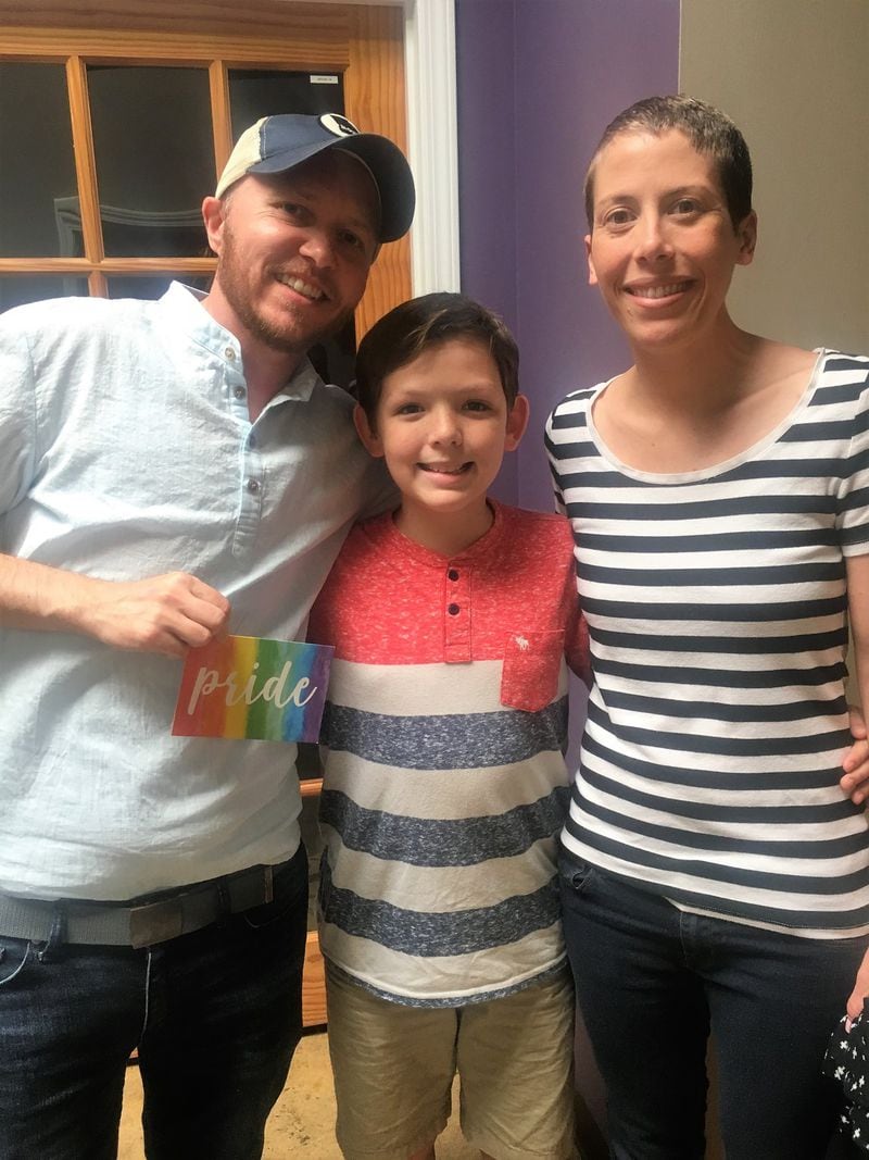 Ten-year-old Bennett Stone (center), with James Sheffield and Emily Halden Brown at Georgia Equality office, where he dropped off “Love Notes” from his school. CONTRIBUTED