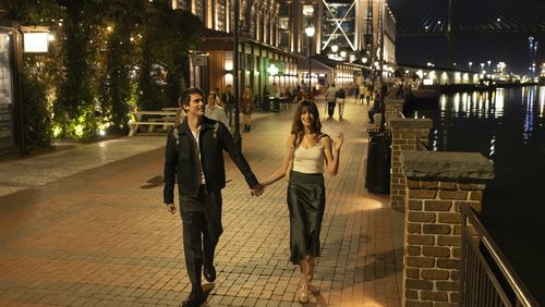 Nicholas Galitzine, left, and Anne Hatheway in “The Idea of You." They are in Savannah, which masquerades as a European city while the fictional band August Moon is on tour.  (Alisha Wetherill/Prime Video/TNS)