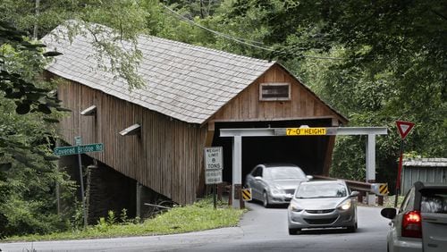 June 20, 2019 - Smyrna - June 20, 2019 - Smyrna - Cobb County’s covered bridge gets a second warning device to stop drivers from running into the historic covered bridge on Concord Road. It will join the older warning device seen here, which is made of steel beams to absorb a blow from a too-tall vehicle. Bob Andres / bandres@ajc.com