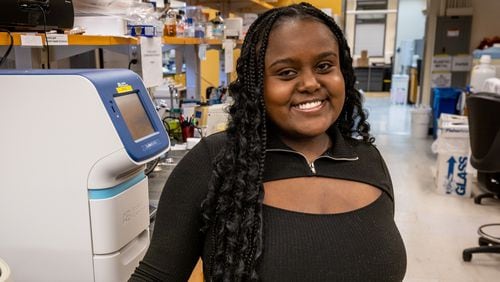 Emory University junior Hasset Nurelegne poses for a photograph in her workspace at the O. Wayne Rollins Research Center on the Emory campus Tuesday, Mar 12, 2023.  (Steve Schaefer/steve.schaefer@ajc.com)
