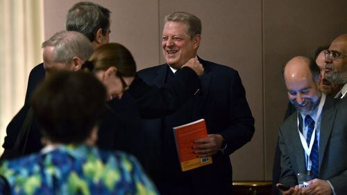 Feb. 16, 2017 Atlanta - Former vice president Al Gore (center) is greeted by participants during Climate & Health Meeting at the Carter Center on Thursday, February 16, 2017. The conference was cancelled by the U.S. Centers for Disease Control and Prevention in the aftermath of Donald Trump’s election victory, but was later rescheduled and moved to the Carter Center. HYOSUB SHIN / HSHIN@AJC.COM