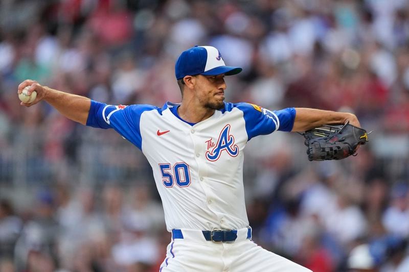 Atlanta Braves pitcher Charlie Morton (50) works in the first inning of a baseball game against the Texas Rangers Saturday, April 20, 2024, in Atlanta. (AP Photo/John Bazemore)