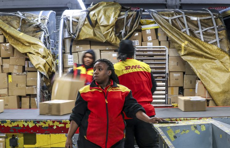 December 15, 2022 ATLANTA: About 40 drivers load their trucks each morning at the DHL Express facility next to Hartsfield-Jackson International Airport, with some of the boxes and packages that were flown in on DHL cargo aircraft overnight. (John Spink / John.Spink@ajc.com)


