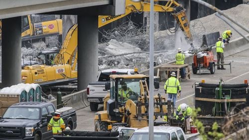 Construction crews continue to work around the clock Monday morning, April 3, 2017 as the commute around the gaping hole in I-85 wasn’t as bad as some expected.