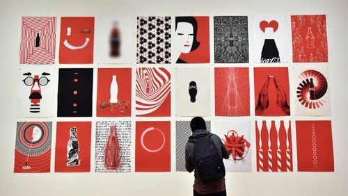 Posters on display at The Coca-Cola Bottle: An American Icon at 100 at The High Museum of Art running through Oct. 4. HYOSUB SHIN / HSHIN@AJC.COM