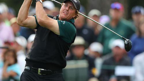Phil Mickelson tees off on the 17th hole during the Masters at Augusta National Golf Club on Thursday, April 5, 2018, in Augusta.  Curtis Compton/ccompton@ajc.com