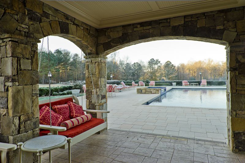 Former Atlanta Braves pitcher John Smoltz is selling his $7.2 million estate, located on 19.7 acres in the gated Greystone community in Milton. According to the listing by Harry Norman Realtors, the 18,000-square-foot home includes 10 bedrooms, 10 bathrooms, an au pair suite, a studio apartment and an eight-car garage. The property also features a custom-designed 18-hole golf course, tennis and basketball courts, a pool and spa, baseball and football fields, a fishing pond and a jogging trail.