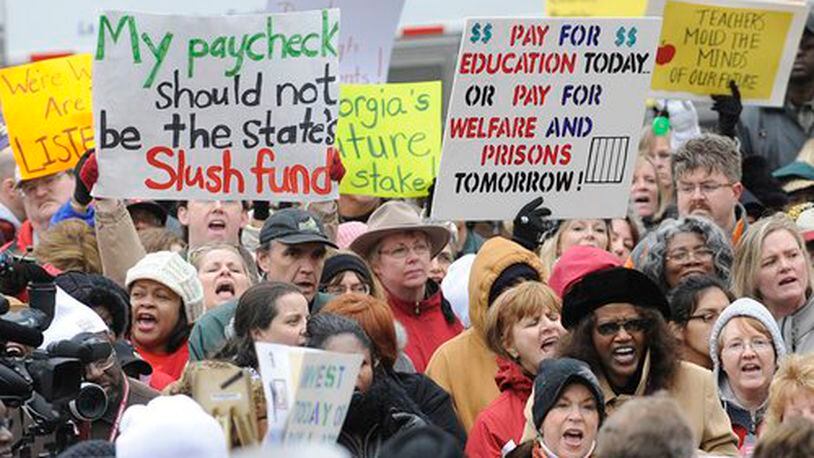 A retired University of Georgia education professor says Georgia asks a lot of its teachers and schools, but are taxpayers willing to invest more in schools to reach these higher, more ambitious goals? Educators have long protested that the state adds more responsibilities to their jobs without a commensurate increase in compensation. (AJC file photo)