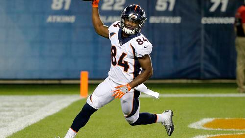 Denver Broncos wide receiver Isaiah McKenzie (84) celebrates a touchdown reception during the second half of an NFL preseason football game against the Chicago Bears, Thursday, Aug. 10, 2017, in Chicago. (AP Photo/Charles Rex Arbogast)