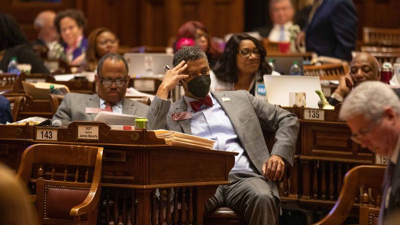 Rep. James Beverly, center, sits during a vote on the last day of this year's session of the General Assembly. State House Democrats picked Beverly on Tuesday to serve another term as the party's leaders in the chamber. Branden Camp/ For The Atlanta Journal-Constitution
