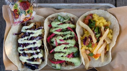 Three tacos from Strange Tacos in Lawrenceville (left to right): lamb, duck and migas. CONTRIBUTED BY HENRI HOLLIS