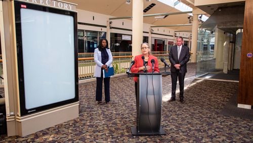 U.S. Rep. Carolyn Bourdeaux talks during a press conference flanked by Gwinnett County Commission Chairwoman Nicole Love Hendrickson (L) and Gwinnett Place Community Improvement District Director Joe Allen (R) at the mostly vacant Gwinnett Place Mall in Duluth. STEVE SCHAEFER FOR THE ATLANTA JOURNAL-CONSTITUTION