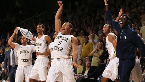 031616 Atlanta: Georgia Tech guard (5) Corey Heyward and the bench react as he hits a three pointer near the end of the game on the way to beating Houston 81-62 during their first round NIT basketball game on Wednesday, March 16, 2016, in Atlanta. Curtis Compton / ccompton@ajc.com
