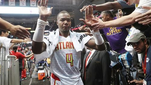 Hawks’ Paul Millsap gets high fives from fans after beating the Wizards 114-99 in the home opener of their NBA basketball game at Philips Arena on Thursday, Oct. 27, 2016, in Atlanta. Curtis Compton /ccompton@ajc.com