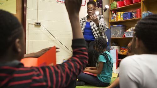 School counselor Tina Johnson meets with a small group of fifth graders that help mentor other students at Flat Shoals Elementary School in south DeKalb County Dec. 8, 2016. (Photo by Phil Skinner)