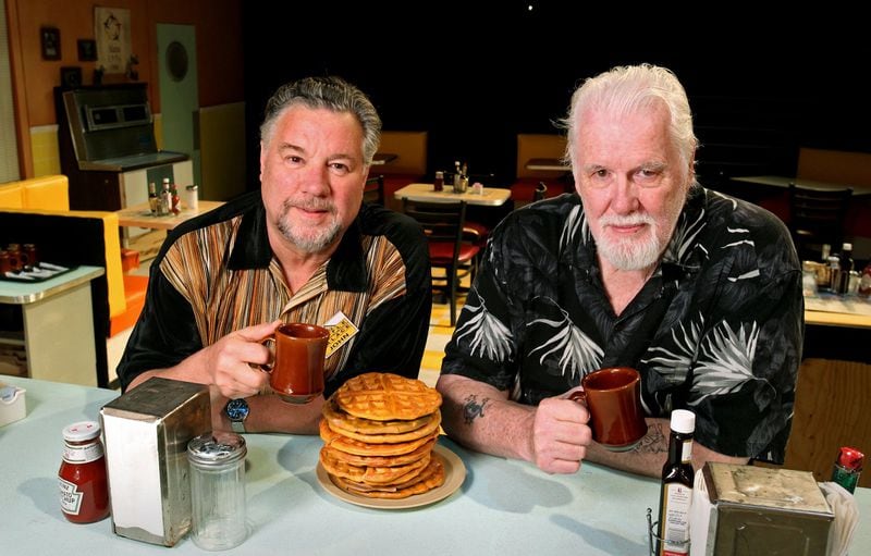“Waffle Palace Christmas” playwrights Larry Larson (left) and Eddie Levi Lee are shown on the set of “The Waffle Palace” at Horizon Theatre in 2012. AJC FILE PHOTO