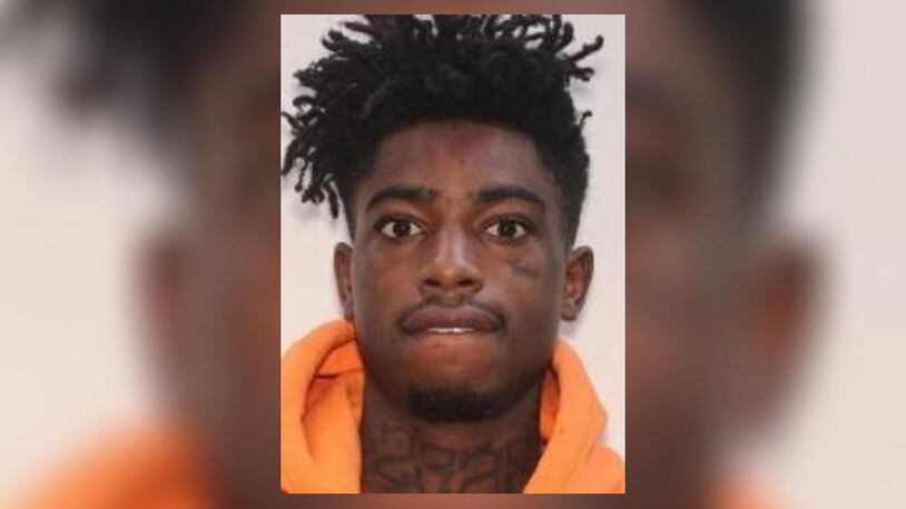 Khari Kelley, 22, of Decatur, is wanted on a felony warrant related to a 210-count racketeering indictment that already resulted in 25 arrests, Gwinnett County police said.