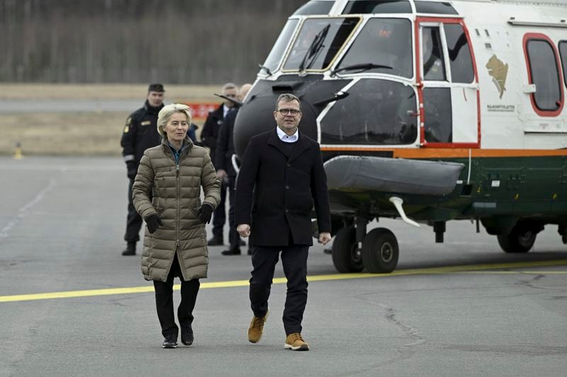 President of the European Commission Ursula von der Leyen, left, and Finnish Prime Minister Petter Orpo arrive for their joint press conference at the Lappeenranta airport, eastern Finland, Friday April 19, 2024. President von der Leyen and Prime Minister Orpo visited the eastern border region of Finland on Friday and discussed what Finland and the EU can do to prevent instrumentalised migration to Finland's eastern border. (Antti Aimo-Koivisto/Lehtikuva via AP)