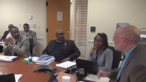 DeKalb Commissioners Steve Bradshaw and Greg Adams listen as Deputy Budget Director Tanikia Jackson and Budget Director Jay Vinicki explain the county's proposed 2017 budget during a Finance, Audit & Budget Committee meeting Feb. 7. Credit: DeKalb County DCTV.