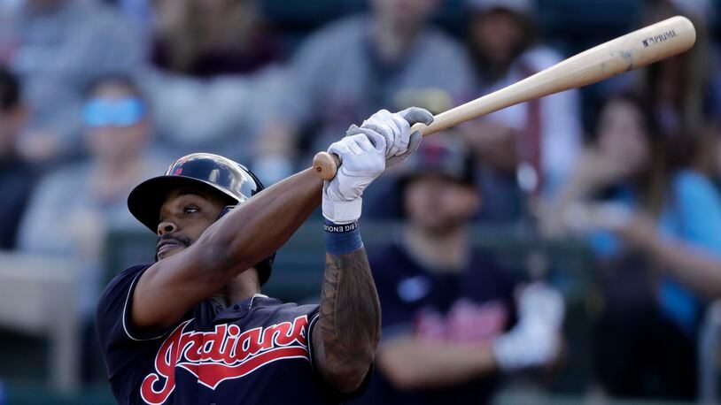 Cleveland Indians' Delino DeShields bats during the third inning of a spring training baseball game against the Kansas City Royals Sunday, Feb. 23, 2020, in Surprise, Ariz. (AP Photo/Charlie Riedel)