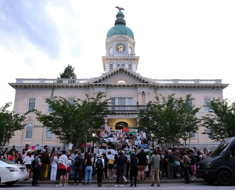 Pro-Palestine protesters marched from the Arch at entrance of the University of Georgia campus to city hall during a rally in Athens on Friday, May 3, 2024. (Nell Carroll for The Atlanta Journal-Constitution)