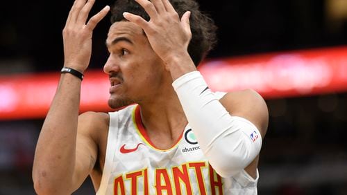 Atlanta Hawks guard Trae Young (11) reacts after being called for a foul against the Chicago Bulls during the second half of an NBA basketball game, Wednesday, Dec. 11, 2019, in Chicago. (AP Photo/David Banks)
