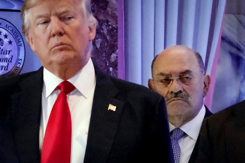 FILE - Allen Weisselberg, right, stands behind then President-elect Donald Trump during a news conference in the lobby of Trump Tower in New York, Jan. 11, 2017. Weisselberg, a former longtime executive in Donald Trump’s real estate empire, is set to be sentenced for lying under oath in the ex-president’s New York civil fraud case. Weisselberg is expected to be sentenced Wednesday to five months in jail after pleading guilty last month to two counts of perjury. (AP Photo/Evan Vucci, File)