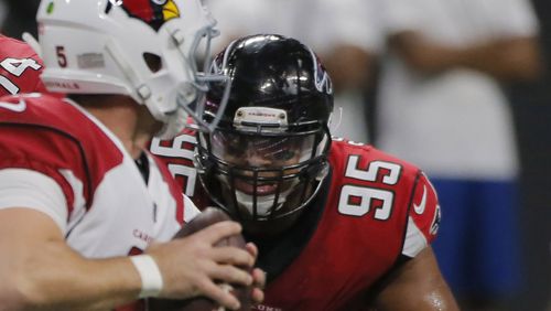 Atlanta Falcons defensive end Takkarist McKinley (98) and Atlanta Falcons defensive end Jack Crawford (95) pressure the Cardinal's QB. The first game in Mercedes-Benz Stadium  was Saturday, as the Atlanta Falcons played Arizona in an exhibition game.. BOB ANDRES  /BANDRES@AJC.COM