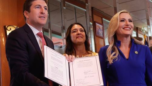 (Left to right) Chairman Bryan Steil (R-Wisconsin), Representative Stephanie Bice (R-Oklahoma), and Representative Laurel Lee (R-Florida)) smile after signing the American Confidence in Elections Act at Marietta Diner on Tuesday, July 10, 2023.  (Natrice Miller/The Atlanta Journal-Constitution)