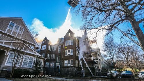 Atlanta firefighters battle a blaze at a three-story apartment building in Midtown.