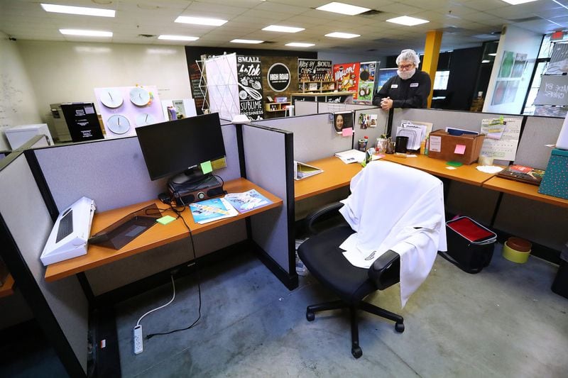 Owner Keith Schroeder pauses in what he calls an eerily quiet sales and marketing department at his business High Road Ice Cream on Tuesday, March 31, 2020, in Marietta. The department is normally bustling with 16 employees who are all now working from home. (Photo:    Curtis Compton / ccompton@ajc.com)
