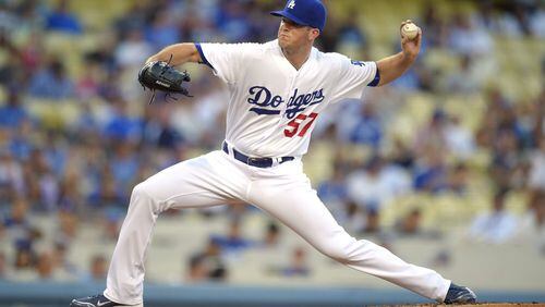 Alex Wood, traded to the Dodgers in July, is one of at least 17 players who were with the Braves within the past year and are now with organizations that have either secured postseason berths or remain in contention. (AP photo)